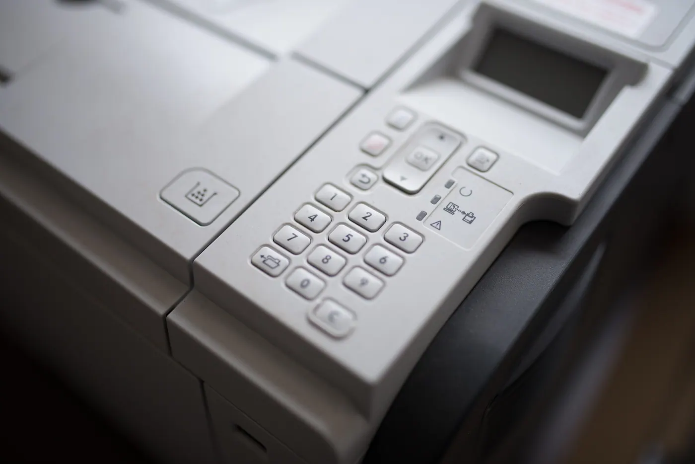 Stock photo: close-up of the keypad and small display on an office printer.