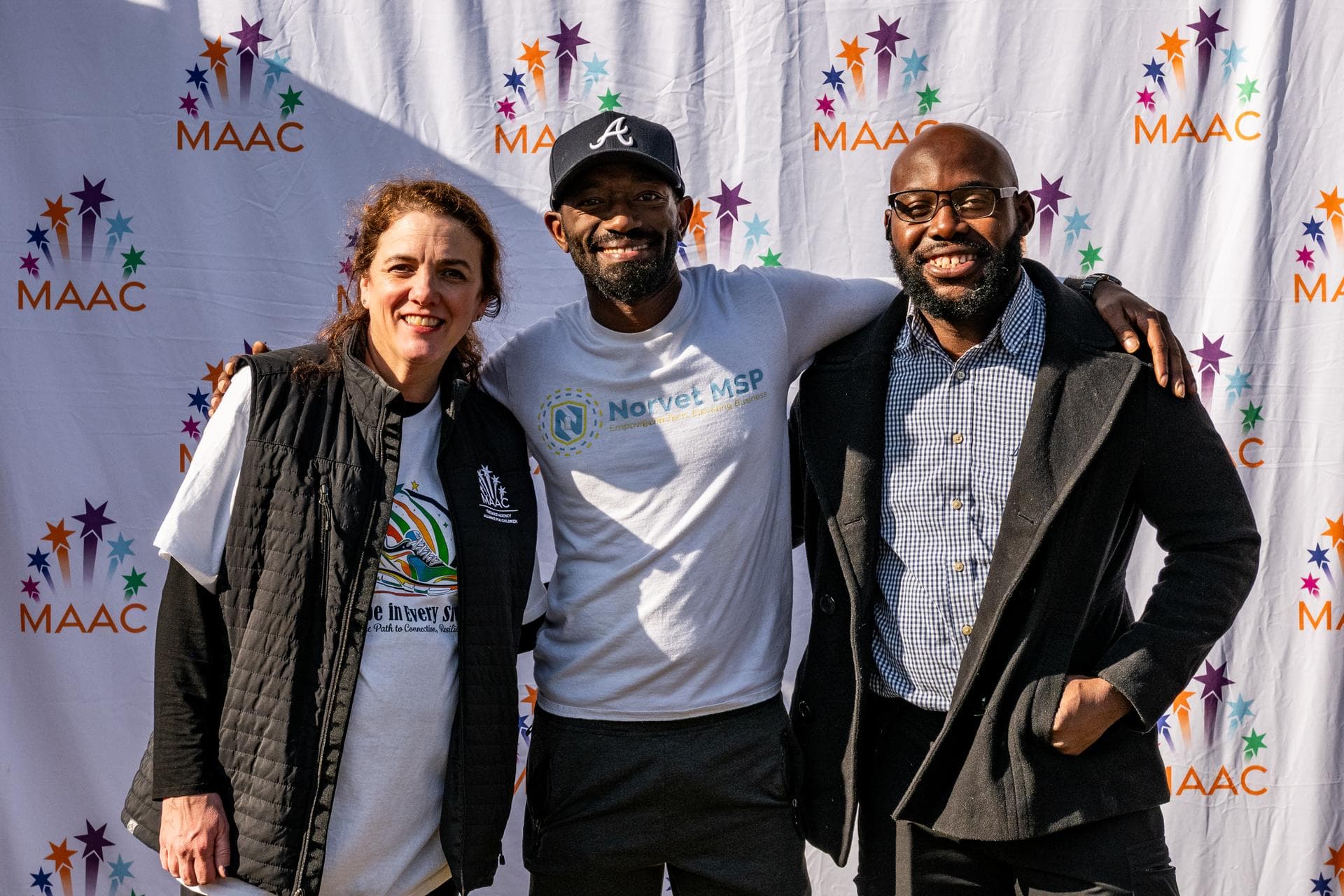 Gregory Rivers with MAAC nonprofit partner team at community event