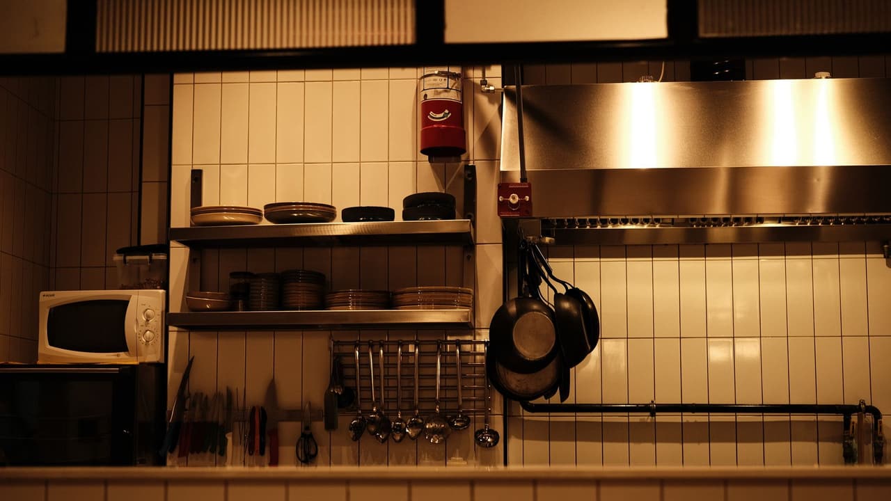 Stock photo: a well-organized restaurant kitchen with pans and shelves.